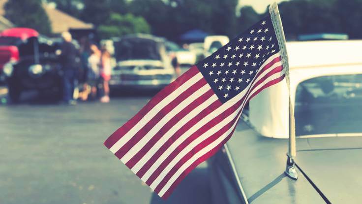 American flag on vintage car